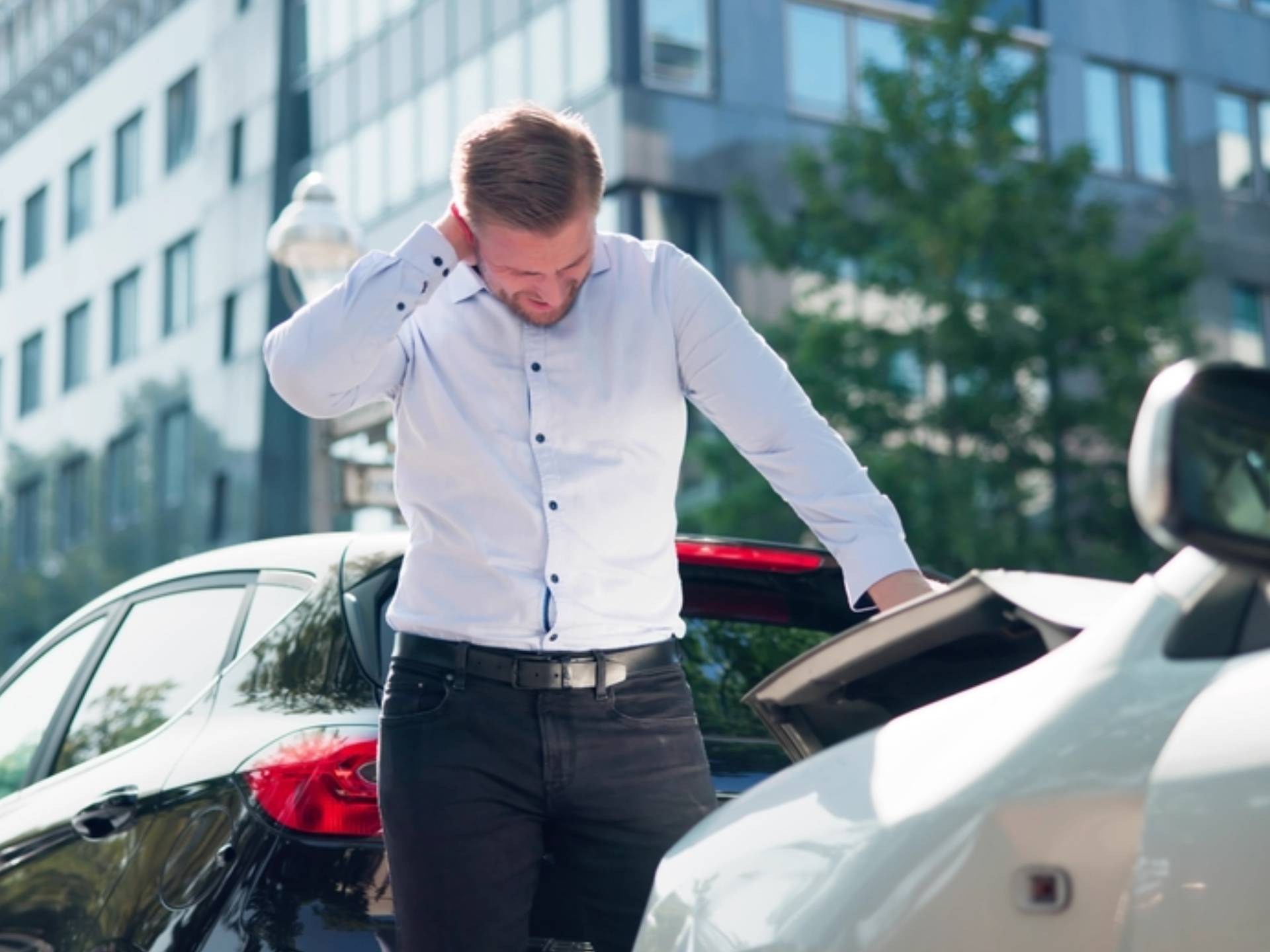 Young Man Suffering From Neck Pain After Car Accident