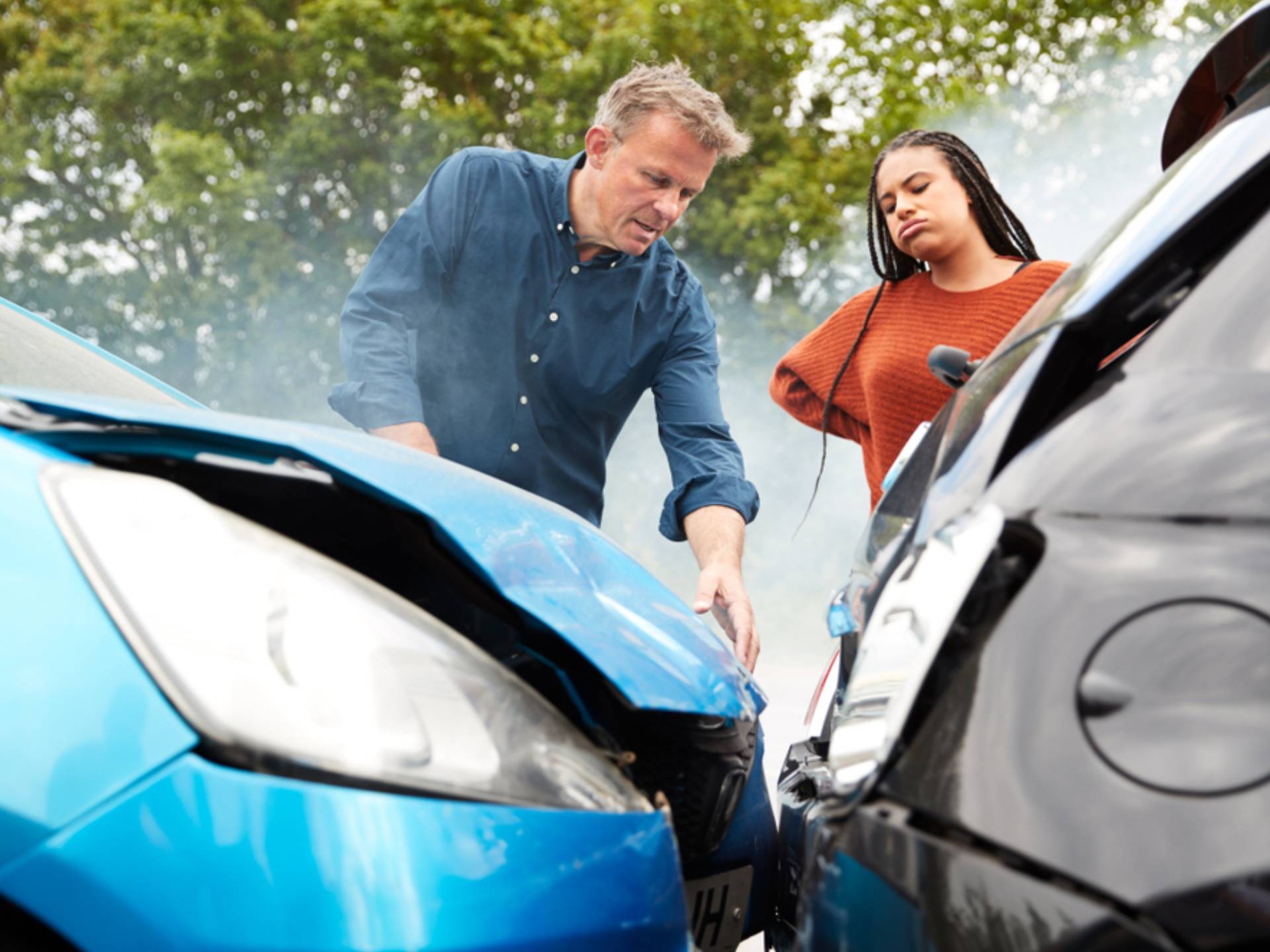 Two Angry Motorists Arguing Over Responsibility For Car Accident