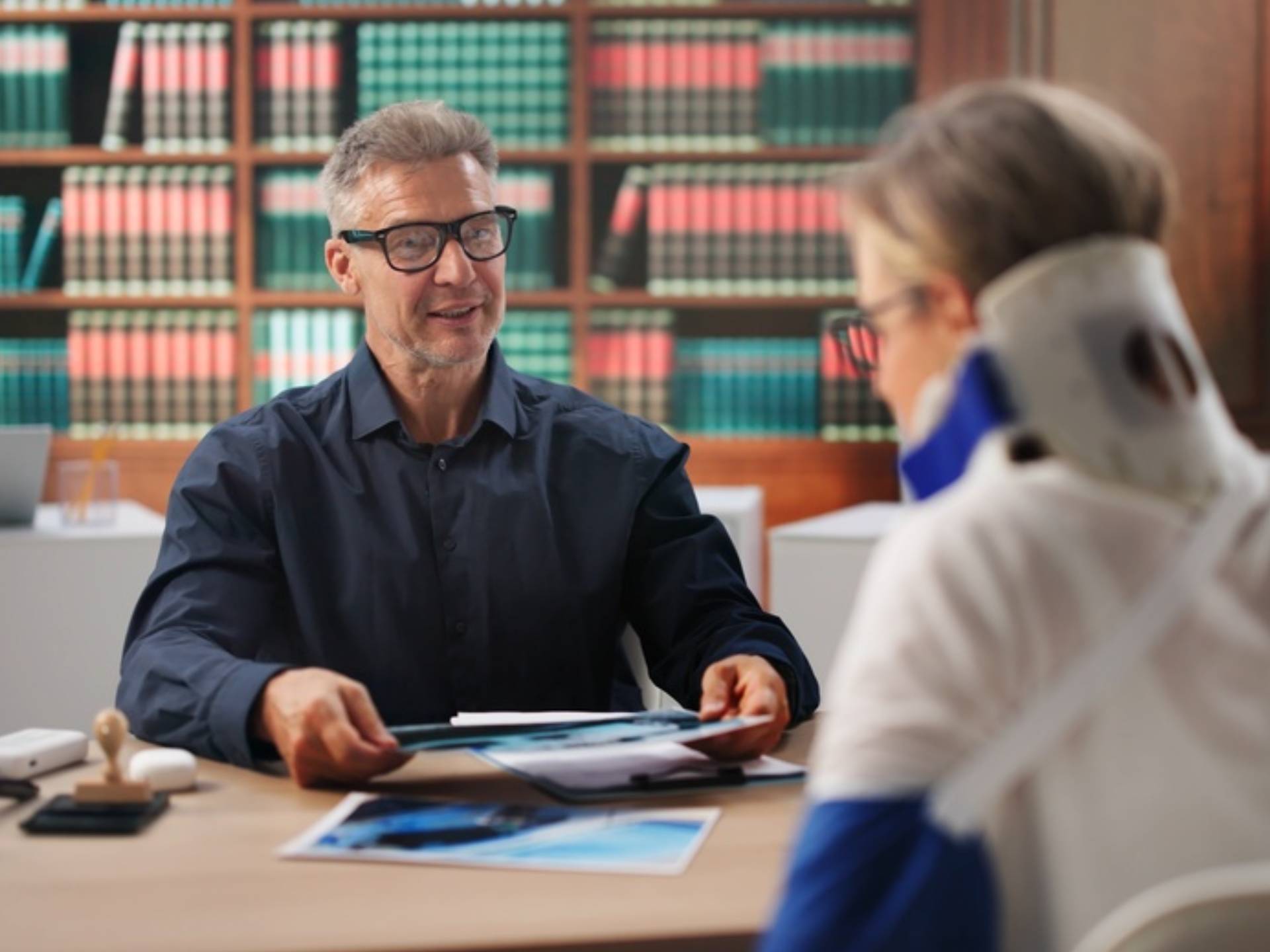 Personal Injury Lawyer Reviews Car Accident Claim With Female Client Today.